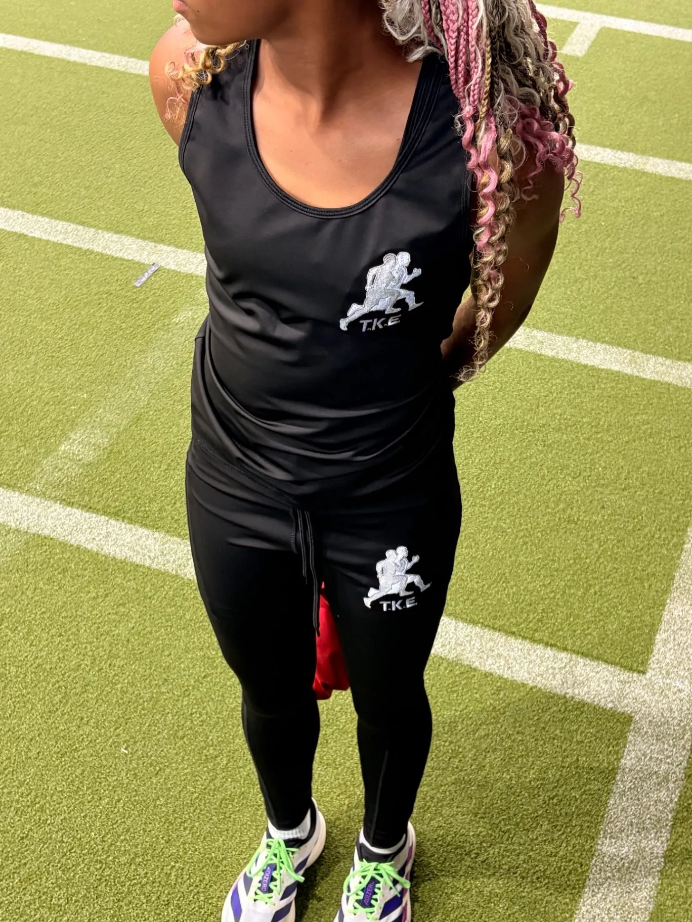 Nailah Belcher in black training kit on the indoor turf