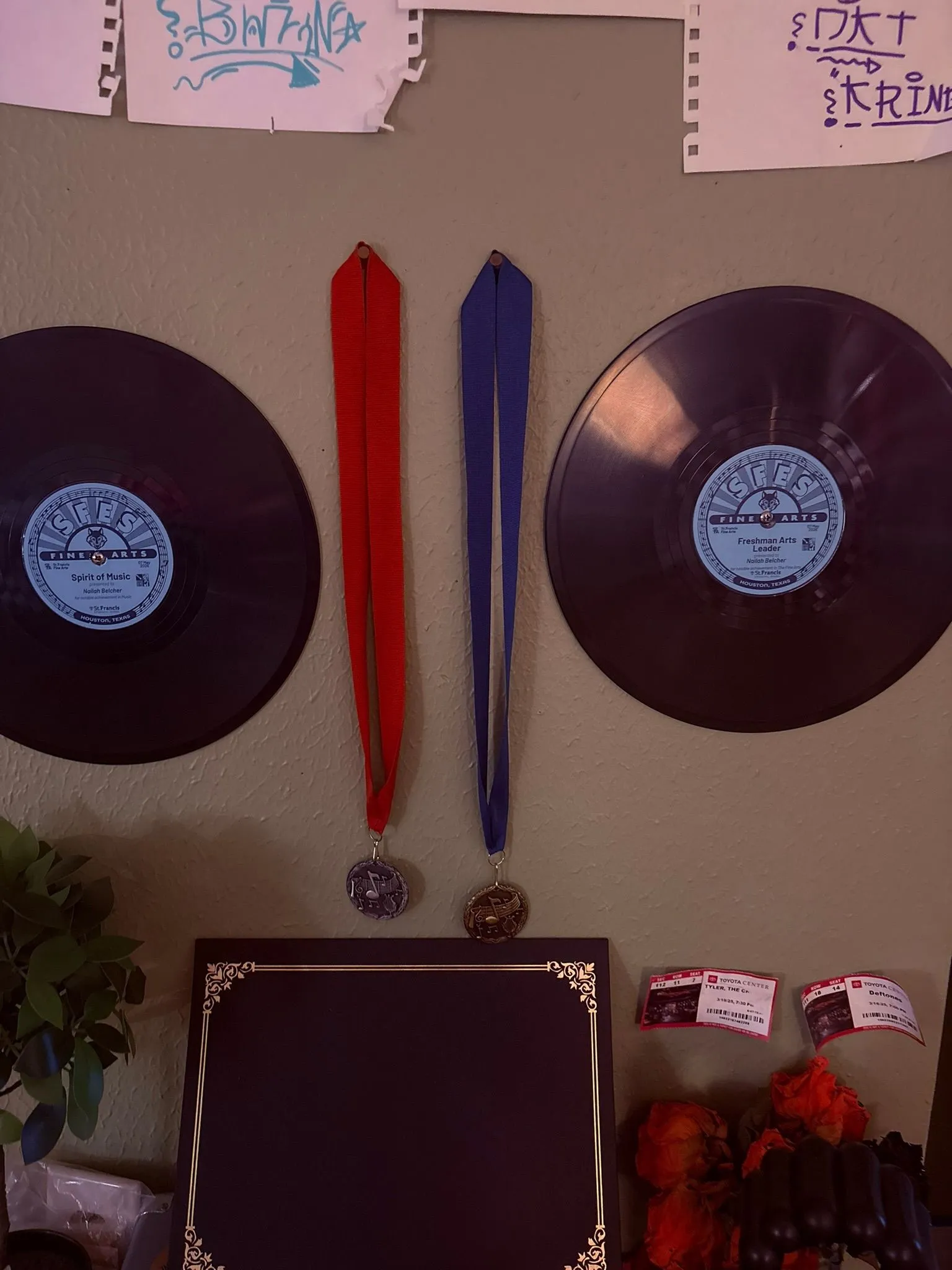 Nailah Belcher's display of Spirit of Music and Sophomore Arts Leader records with medals and a plaque